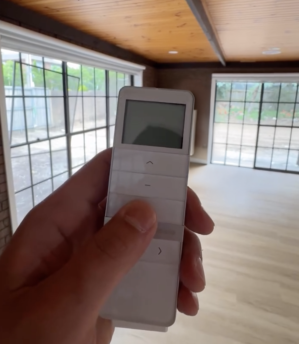 Remote control for motorised blinds in a renovated living room