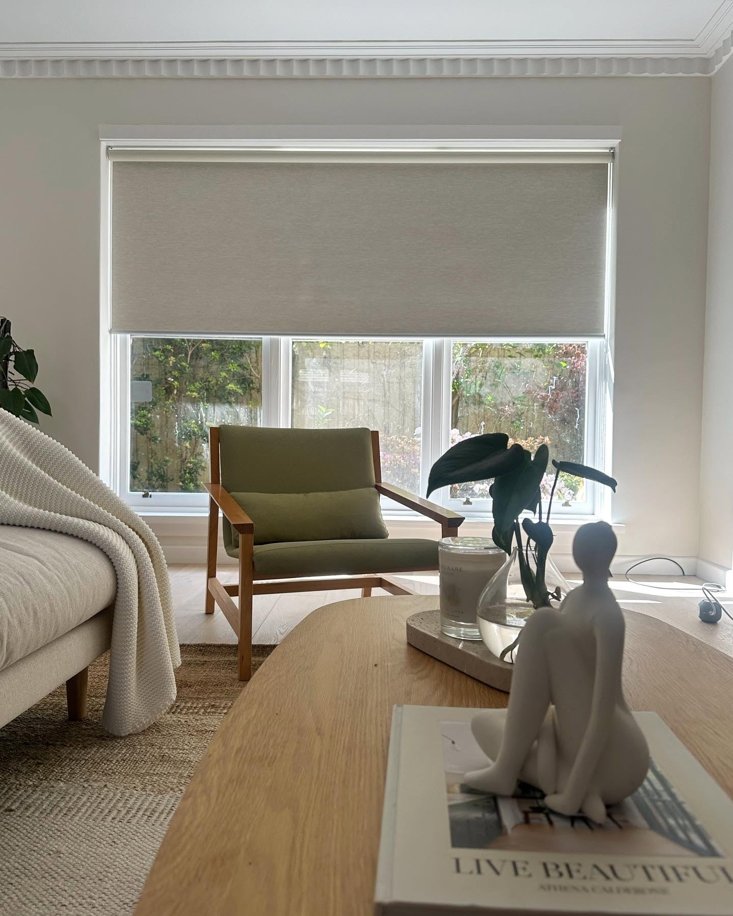 Living room with a light roller blind