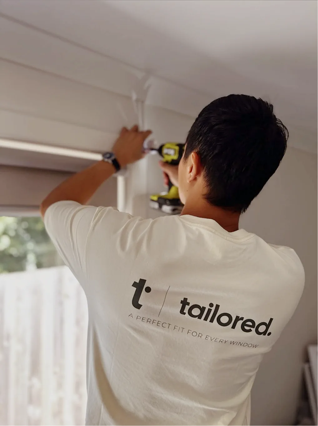 Tailored Blinds installer fitting a blind bracket