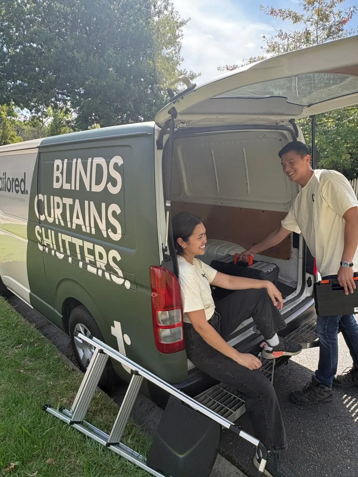 Tailored Blinds team loading the branded van