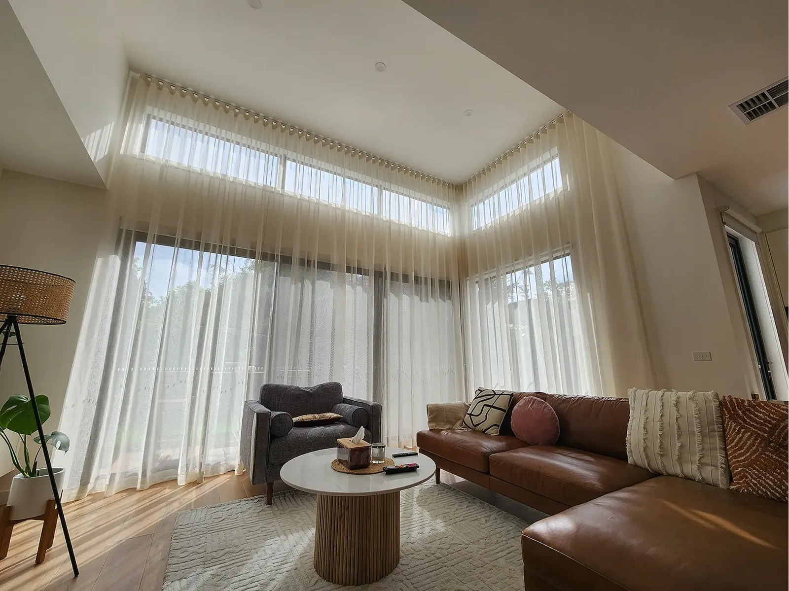 Living room with floor-to-ceiling sheer curtains